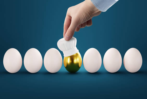 istock The hand puts a cook hat on the egg. 1465564520