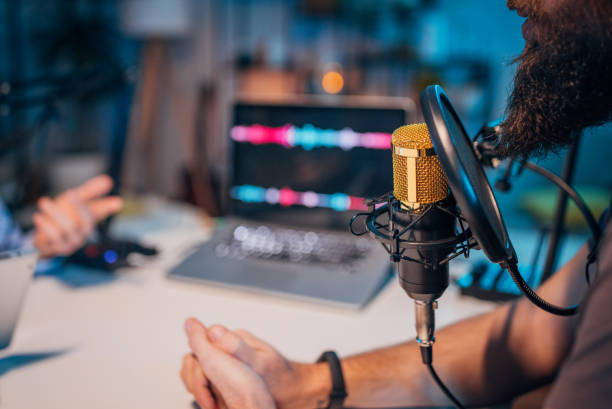 istock People in the podcast studio talking and recording 1465564636