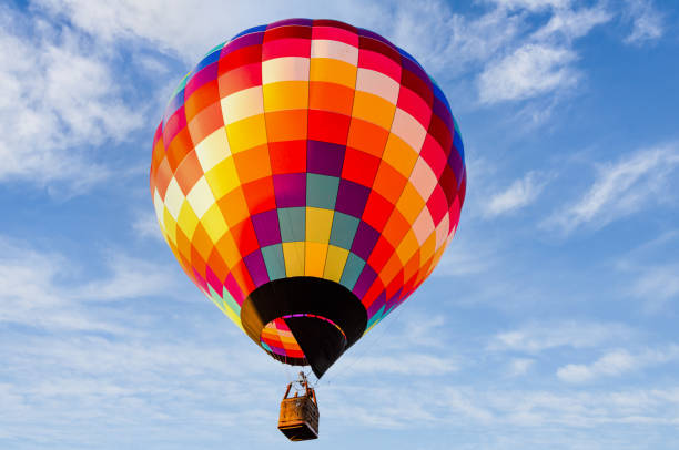 istock Hot air balloon flight over blue sky 1465564929