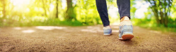 istock Woman walking in the natural park in spring 1465566650