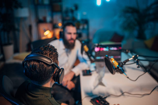 istock People in the podcast studio talking and recording 1465566752