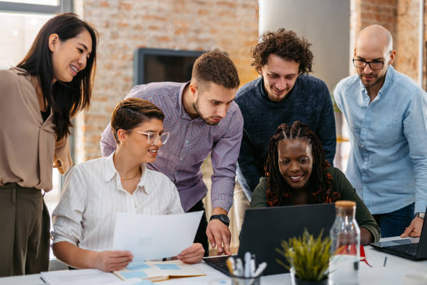 istock Colleagues Working Together In The Office 1465566939