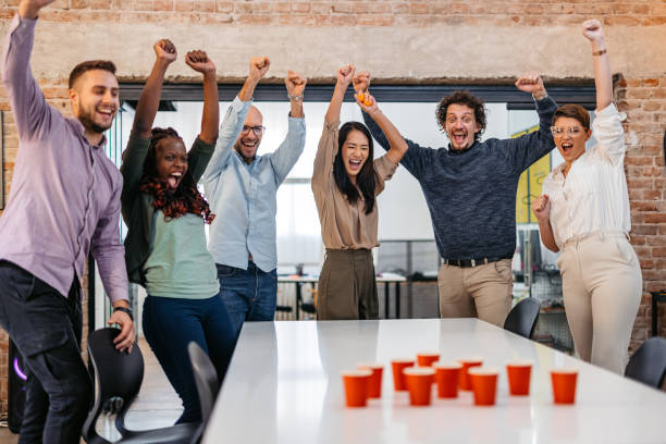 istock Colleagues Playing Beer Pong At The Office 1465567019