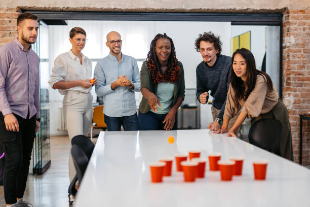 istock Colleagues Playing Beer Pong At The Office 1465567276