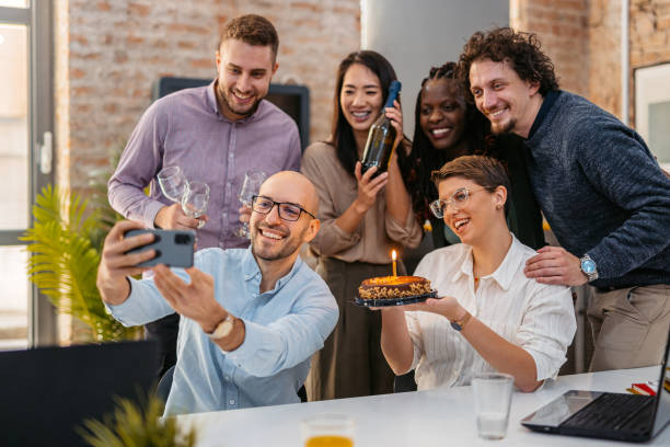 istock Colleagues Taking A Selfie At The Office Birthday Party 1465567381