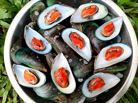Steamed Green Mussels with basil leaf - Thai food.