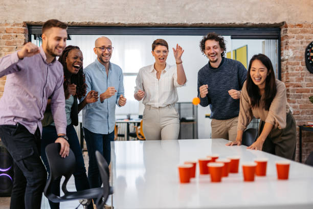 istock Colleagues Playing Beer Pong At The Office 1465567493