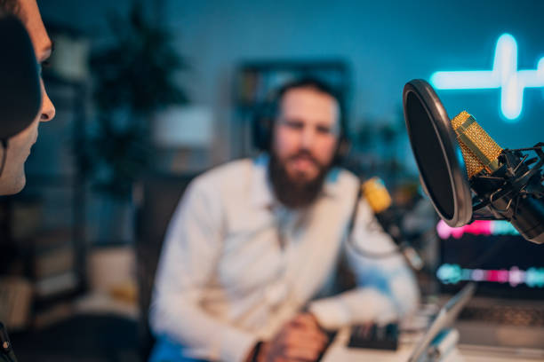 istock People in the podcast studio talking and recording 1465567630