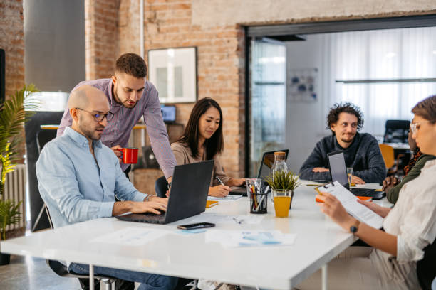 istock Colleagues Working Together In The Office 1465567689
