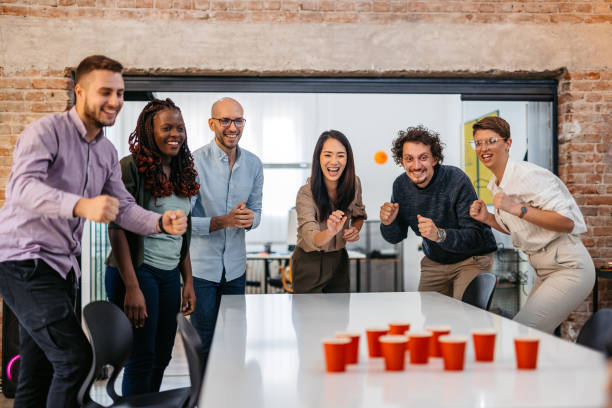 istock Colleagues Playing Beer Pong At The Office 1465567729