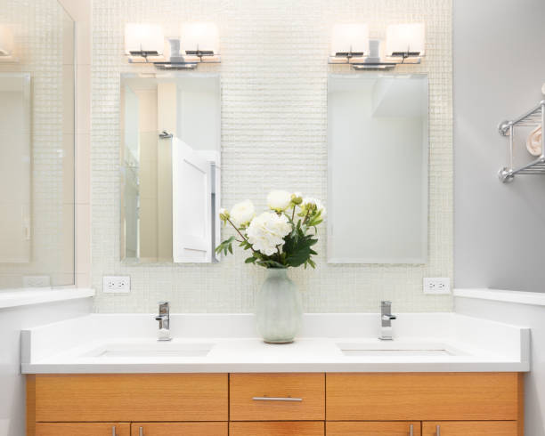 istock A bathroom with a wood cabinet and tiled backsplash. 1465567897