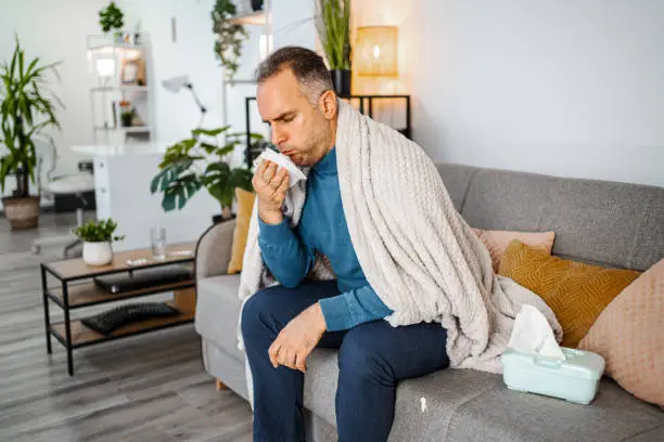 Sick man catching seasonal flue