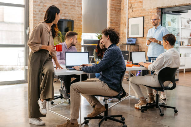 istock Colleagues Consulting With Each Other While Working Together In The Office 1465567924