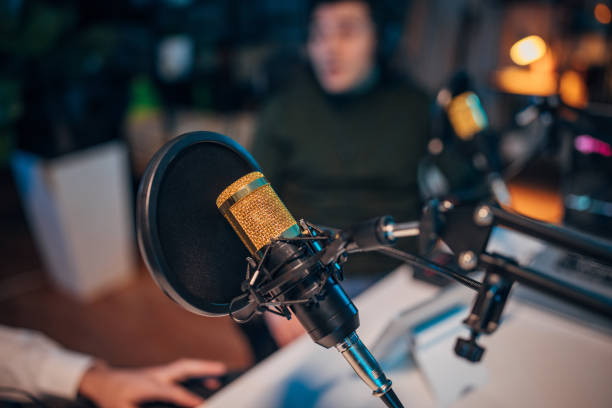 istock People in the podcast studio talking and recording 1465569719