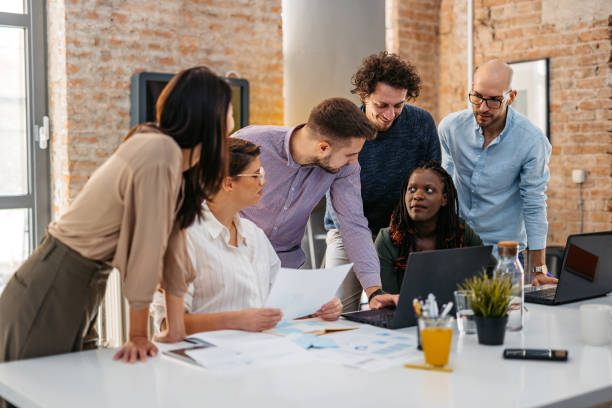 istock Colleagues Working Together In The Office 1465569737