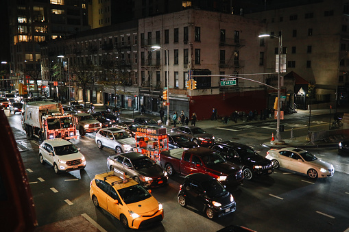 Traffic on the streets of Manhattan, New York, at night.