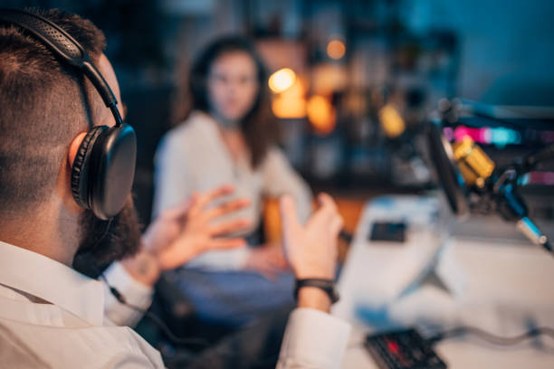istock People in the podcast studio talking and recording 1465570015