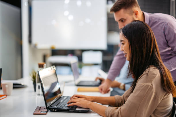 istock Colleagues Consulting With Each Other While Working Together In The Office 1465570676
