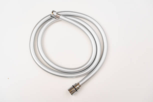 New flexible rubber shower hose on a white background. the concept of a new and modern plumbing for the bathroom.