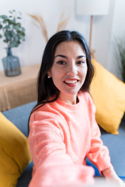 istock Happy woman looking at camera taking a selfie 1465572696