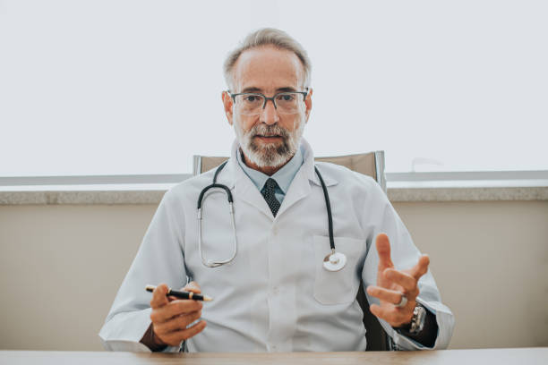 Portrait of a doctor in a video conference call stock photo