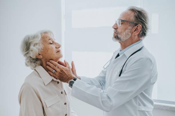 istock Senior patient with sore throat, doctor consultation 1465572953