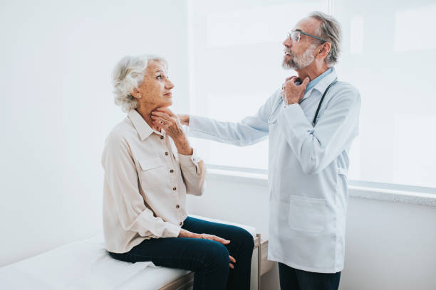 istock Senior patient with sore throat, doctor consultation 1465572968