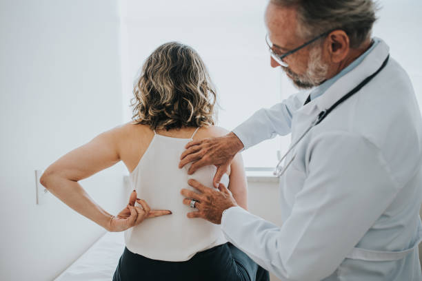 istock Patient with back pain, medical evaluation 1465573014