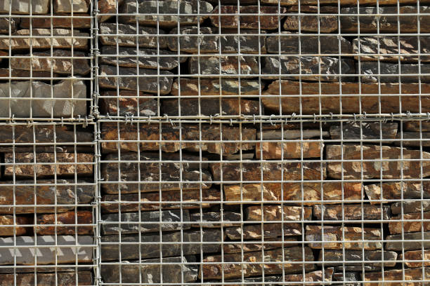 Fence with gabions and stones