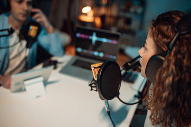 istock People in the podcast studio talking and recording 1465573951