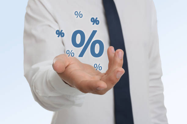 istock Man showing virtual percent sign on white background, closeup. Discount concept 1465574155