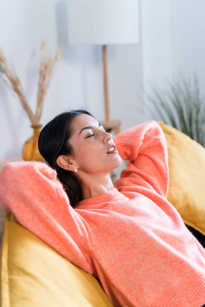 istock woman with closed eyes at home 1465574875