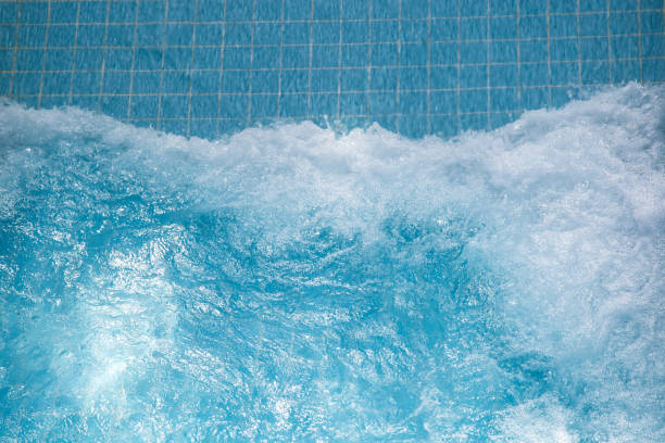 istock Artificial wave in the pool on a blue background, close-up 1465575574