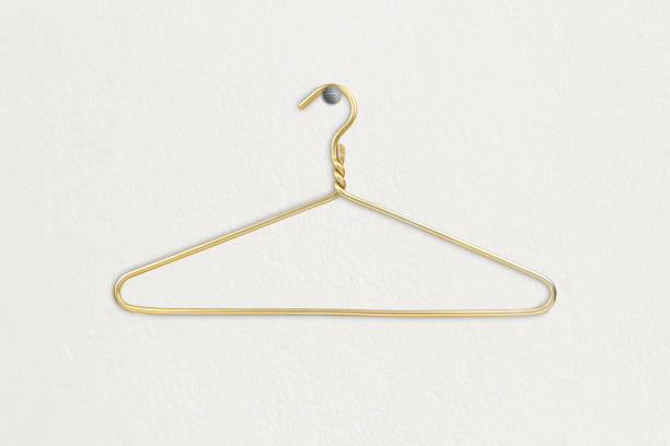 istock Clothes hanger hangs on a white wall, space for text or clothes 1465576059