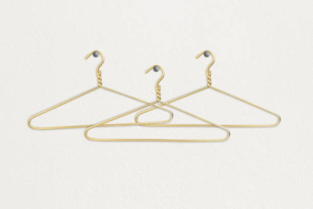 istock Clothes hanger hangs on a white wall, space for text or clothes 1465576084