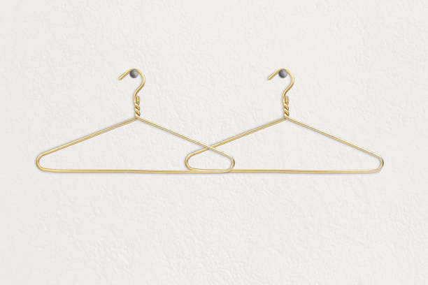 istock Clothes hanger hangs on a white wall, space for text or clothes 1465576106