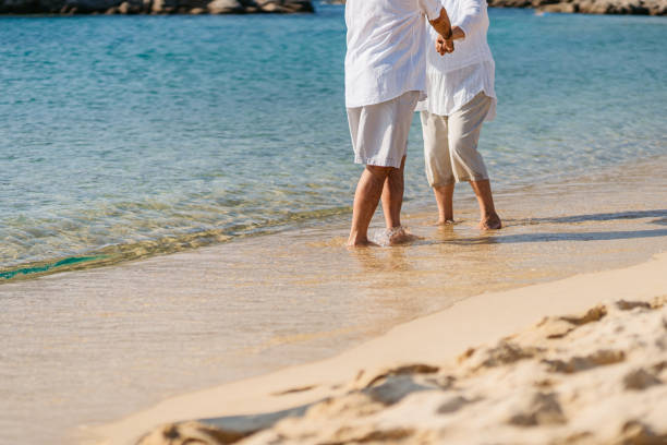 istock Senior Couple Dancing On The Sunny Beach 1465576639