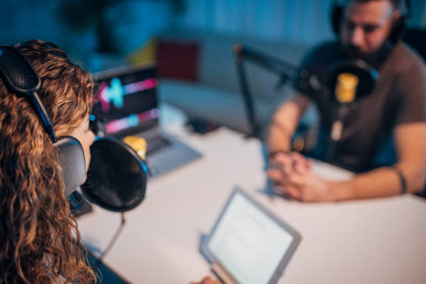 istock People in the podcast studio talking and recording 1465578548