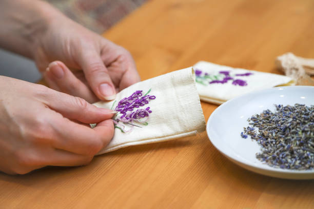 istock Making lavender aromatherapy sachet with floral embroidery at home. Zero waste DIY gift. Photo with selective focus 1465581320