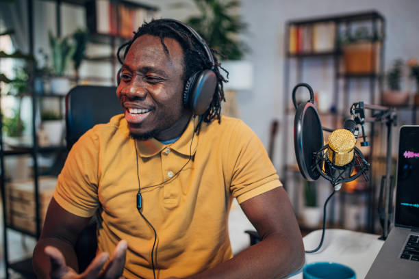 istock Man in podcast studio recording a show 1465581487