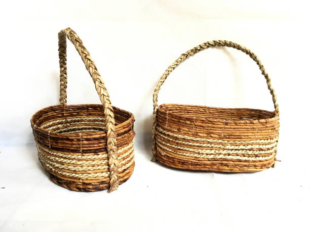 istock Basket weaving with handle made from Banana Bark and Pandanus odorifer or fragrant screw-pine on a white background for product photography 1465582591