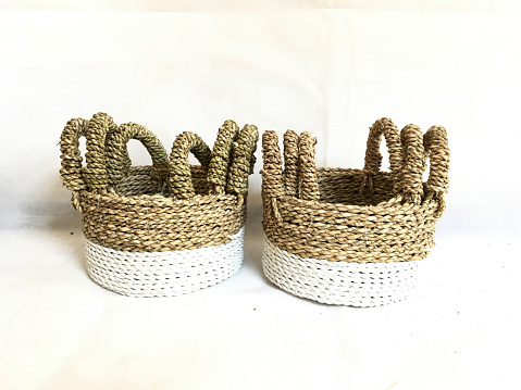 Multi colored Round Basket weaving with handle made from Pandanus odorifer or fragrant screw-pine on a white background for product photography