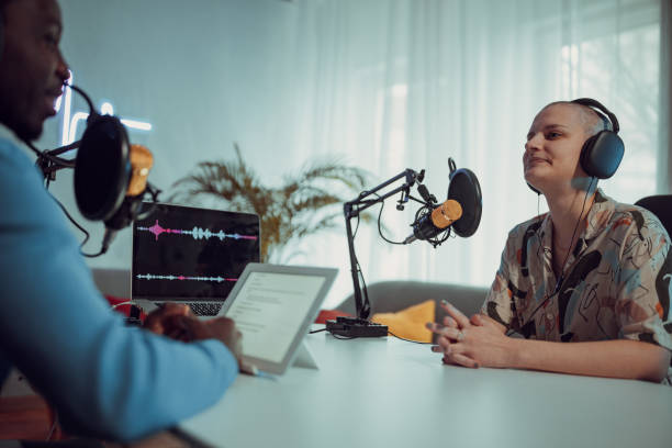 istock People in the podcast studio talking and recording 1465585438