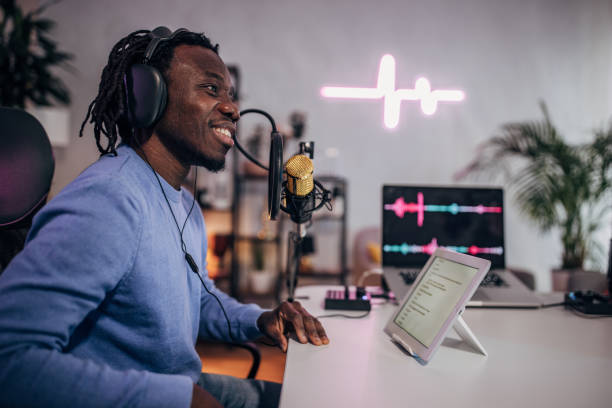 istock Man in podcast studio recording a show 1465585614