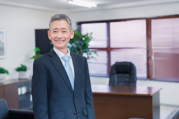 Executive management with arms crossed in the boardroom
