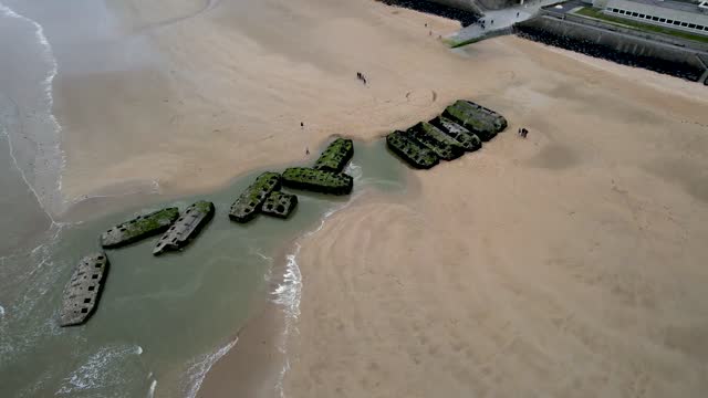Aerial view of town of Arromanches les Bain in Normandy France with WW2 bunker ruins