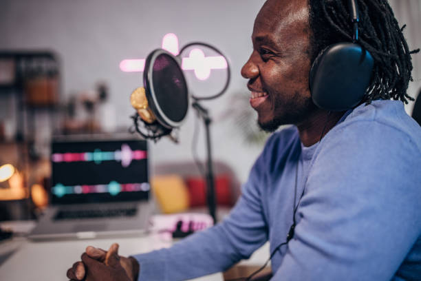 istock Man in podcast studio recording a show 1465587450