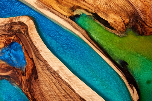 Texture of a wooden table with epoxy resin closeup