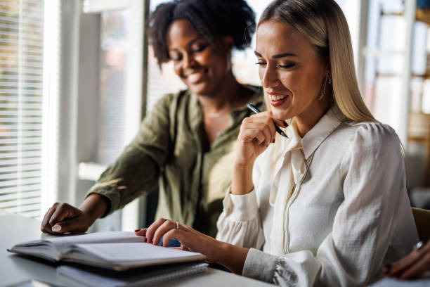 istock Two businesswomen going over their notes when working on a project together 1465587785