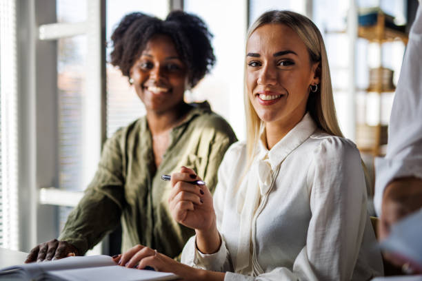 istock Two businesswomen going over their notes when working on a project together 1465587787